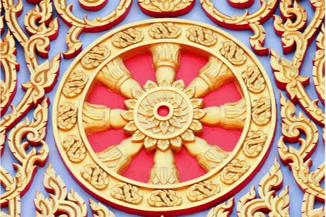 Gilded Dharma wheel carving from a Thai temple